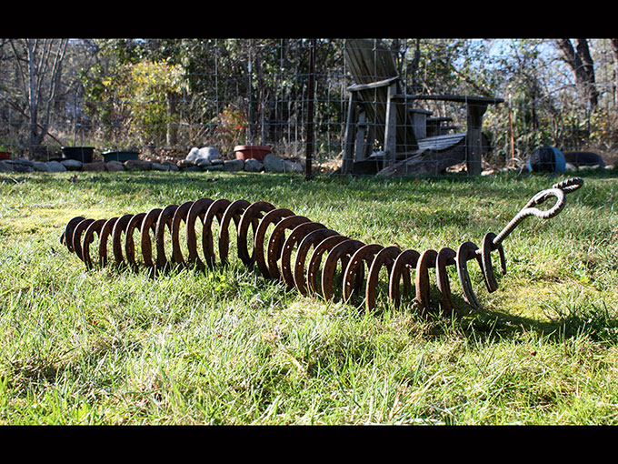 caterpillar metalwork rusty metal horse shoe art sculpture welding jeremy criswell jacksonville oregon public art