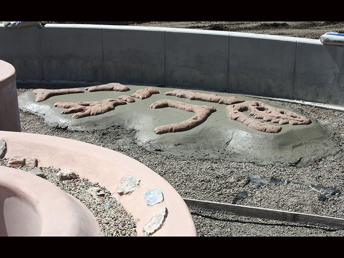 Oregon Hills Park public art project cement dinosaur bones